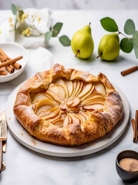 There's something truly special about enjoying a warm, homemade dessert that embodies the essence of the fall season. And when it comes to rustic elegance and irresistible flavors, few desserts can compare to a Rustic Cinnamon Pear Galette. This free-form tart showcases the natural beauty of pears, delicately spiced with cinnamon, and nestled in a... Read More The post <a rel="nofollow... Pear Galette, Canned Pears, Galette Recipe, Sliced Pears, Homemade Dessert, Spiced Pear, Pastry Crust, Desserts For A Crowd, Half Baked Harvest