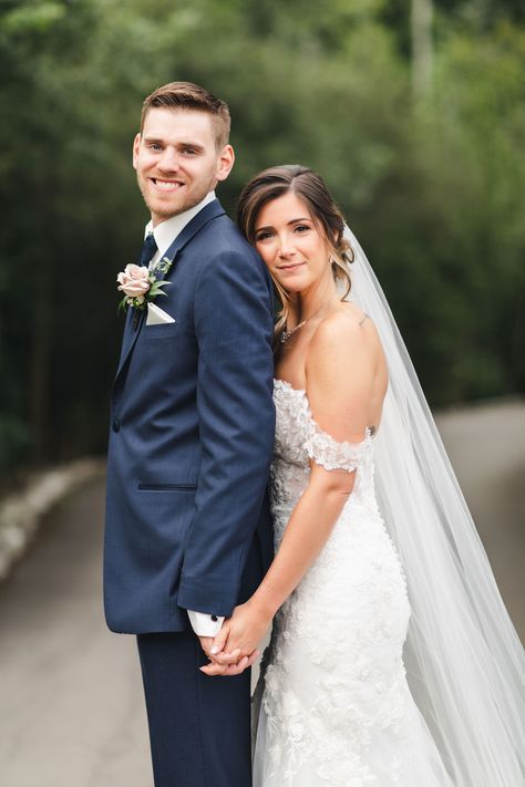 Bride wearing off the shoulder lace wedding dress with cathedral veil in a beautiful up-do with natural glam makeup. Groom wearing Navy suit with white and pink boutonnière. Photo taken at Whistle Bear in Cambridge Ontario by Sandra Monaco Photography.  #WeddingPose #VeilInspiration #CandidPosing #Posing #CouplePose #CandidWedding #Elegant #Romanticposing #PosingInspiration #CouplesPosing #RomanticWedding #WalkingPose #OffShoulderWeddingDress #WeddingDressInspo #WhistleBear Bride And Groom Classic Poses, Chest To Chest Wedding Pose, Bride Behind Groom Wedding Photos, Wedding Bridal Picture Ideas, Formal Bride And Groom Photos, Bride And Groom Romantic Poses, Wedding Photos Poses Bride And Groom, Bride Pictures Ideas Wedding Day, Easy Wedding Photo Poses