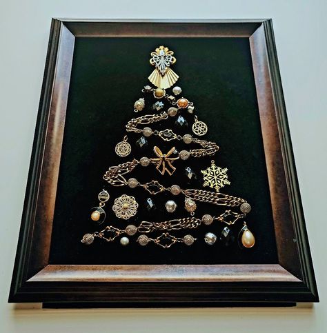 More Christmas Trees section from this shop:  https://www.etsy.com/shop/OddBeadsShoppe?section_id=45713888 Vintage Christmas Tree | Christmas tree in a frame | Christmas Tree | Christmas Tree Wall hanging | Christmas Gift What can be a better gift to yourself or your family members than a pretty vintage style Christmas Tree in a frame?  Made of beads and chains and jewelries, all carefully chosen and balanced in shapes and colors! The design is totally unique, this is a one-of-a-kind artwork, there are no exact copies of it. The elements of the Piece are attached properly and cannot be moved, replaced or detached. The piece is shipped as shown in a picture.  The vintage style frame is ready to hang on the wall or to be placed on your table on a shelf. There is no glass covering the item in A Frame Christmas, Christmas Button Crafts, Old Jewelry Crafts, Costume Jewelry Crafts, Jeweled Christmas Trees, Vintage Style Christmas, Vintage Jewelry Ideas, Frame Christmas, Jewelry Frames