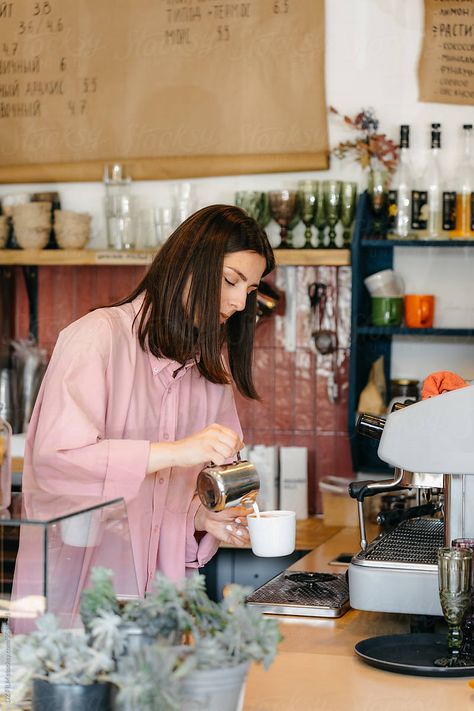 A female barista pours whipped cream into coffee while working in a coffee shop Female Barista, Branding Guide, Customer Persona, Coffee Shop Branding, Shop Branding, Branding Shoot, Aesthetic Coffee, How To Make Coffee, A Cup Of Coffee