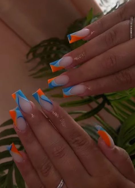 Looking for a way to escape the rat race and recharge your batteries? Check out our amazing selection of vacation nails! Whether you're looking for a aquatic theme, a beach-inspired design, or something more whimsical, we've got you covered. Orange Blue Nails, Colored Acrylic Nails, Summery Nails, Dope Nail Designs, Vacation Nails, Nails Only, Blue Nail, Unique Acrylic Nails, Acrylic Nails Coffin Short