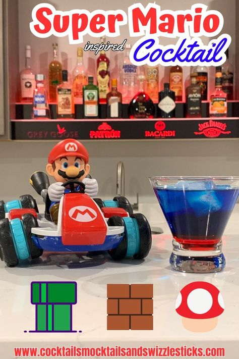 This image shows a blue drink with a red bottom sitting next to mario on a race car in front of a red lighted bar shelf. Drinks For Kids, Game Night Ideas, Super Mario Bros Party, Mario Bros Party, Super Mario Birthday Party, Mario Birthday Party, Super Mario Birthday, Themed Drinks, Mario Birthday