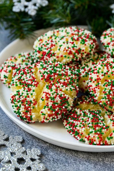 A plate of gooey butter cookies covered in holiday sprinkles. Sprinkle Cookies Christmas, Hot Chocolate Cookies Cups, Snowball Cookie Recipe, Gooey Butter Cookies, Whipped Shortbread Cookies, Easy Christmas Cookie Recipes, Hot Chocolate Cookies, Dipped Cookies, Holiday Dessert Recipes