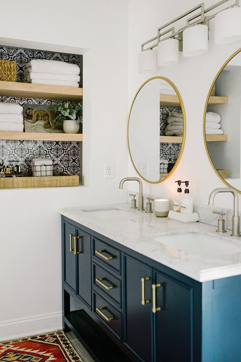 15 Between the Studs Bathroom Storage Ideas! Carve out space between the wall studs to increase storage space in a small bathroom. Boho Double Vanity, Brass And Blue Bathroom, Navy Double Vanity Bathroom, White Bathroom Blue Vanity, Navy And Brass Bathroom, Blue Double Vanity Bathroom, Boho Blue Bathroom, Blue And Brass Bathroom, Boho Bathroom Blue