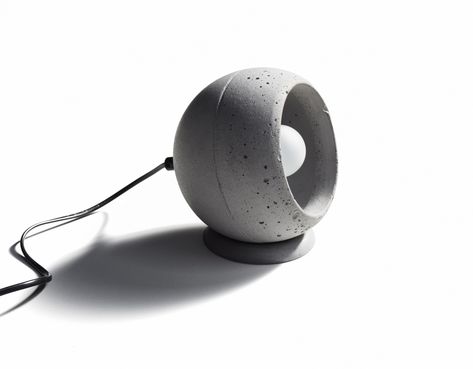 SUPERFLY-T is made of cast concrete. The concrete sphere could be rotated and placed in any position. Design by Urbi et Orbi studio in 2016. Pottery Lighting, Concrete Table Lamp, Concrete Light, Cement Diy, Concrete Lamp, Concrete Sink, Bathroom Furnishings, Concrete Table, Concrete Crafts