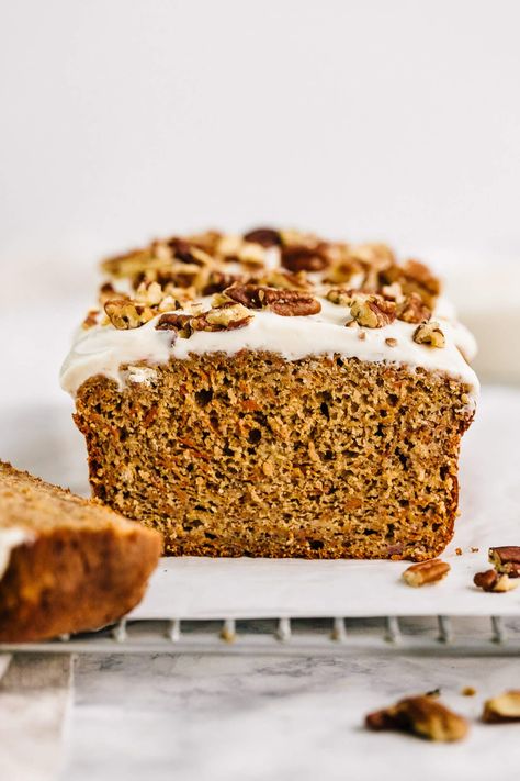 A healthier carrot cake banana bread with dairy-free cream cheese frosting. This recipe is made oat flour, almond flour, maple syrup and topped with a lightened-up cream cheese Greek yogurt frosting. Enjoy for breakfast or to bring to a holiday brunch! Healthier Carrot Cake, Carrot Cake Banana Bread, Greek Yogurt Frosting, Dairy Free Cream Cheese Frosting, Cake Banana Bread, Carrot Cake Bread, Carrot Banana Cake, Healthy Carrot Cake, Bread Healthy