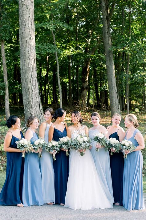 Bride with her Bridemaids dressed in different shades of blue Blue Wedding Theme Indian, Bridesmaids Dresses Navy Blue, Blue Dresses For Bridesmaid, Saphire Dresses Bridesmaid, Blue Themed Wedding Dress, Bridesmaids In Shades Of Blue, Brides Made Dresses Blue, Blue Shades Wedding Theme, Blue Shades Dress