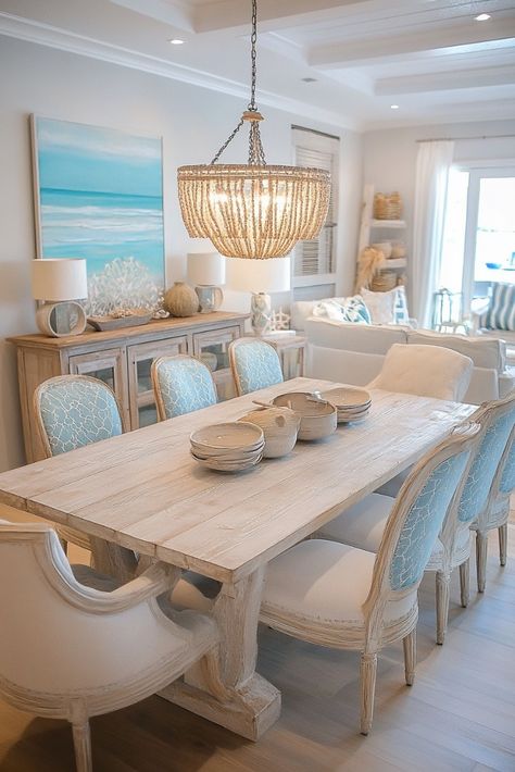 "🌊🍽️ Transform your dining space with Coastal Dining Room Decor! Think light, breezy vibes with nautical accents, driftwood, and soft blues. Perfect for a relaxing, beach-inspired meal at home. 🐚🌴 #CoastalDecor #DiningRoomDesign #BeachStyle" Blue Coastal Dining Room, Beach House Chandelier Dining Rooms, Beachy Dining Table, Beachy Dining Room Ideas, Luxury Bedroom Master Modern White, Beach Glam Decor, Costal Kitchens, Coastal Breakfast Nook, Coastal Dining Room Lighting