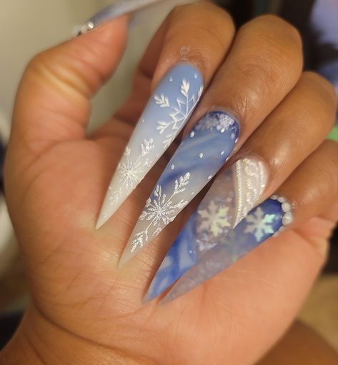 Frosty Nails Winter Wonderland, Blue Christmas Nails Stiletto, Long Winter Nail Designs, Baby Blue Xmas Nails, Icey Nails Winter, Elsa Inspired Nails, Snowy Christmas Nails, Icy Blue Christmas Nails, Christmas Snow Nails