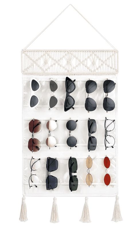 Sunglasses are a summer essential, but they can be a pain to store properly. If you’re not careful, the lenses can get scratched and the frames can become bent. Not to mention, it can be difficult to find them in a cluttered sunglasses drawer! That’s why we’ve put together a list of 10 creative ways... The post 13 Creative Ways to Store Your Sunglasses to Keep Them In Good Condition first appeared on Practical Perfection. Diy Sunglasses Holder, Eyewear Display, Sunglasses Organizer, Glasses Storage, Decorative Tassels, Sunglasses Storage, Tassels Decor, Closet Accessories, Door Hooks