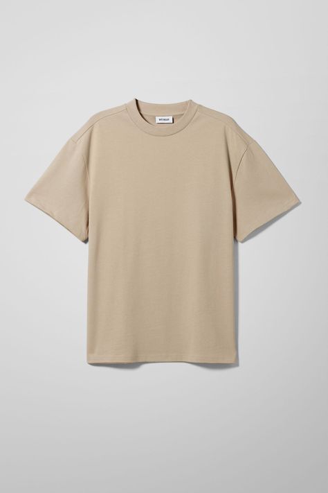 An oversized t-shirt made from a soft heavyweight quality cotton jersey. This classic has a ribbed crew neck, dropped short sleeves that fall just above the elbows, and straight stitched hems. Beige T Shirt Outfit, Beige Shirt Outfit, Beige Tshirt, T Shirt Polos, Nasa Vintage, T Shirt Template, Beige T Shirt, Tan Shirt, Beige T Shirts