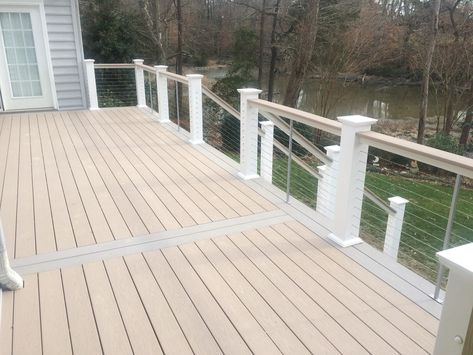 Wolf Serenity Decking in Sand Castle and Harbor Grey, with decorator railings with decking plank caps Wolf Decking, Lake House Deck, Deck Rails, Front Porch Deck, Pvc Siding, Outdoor Living Ideas, Deck Remodel, Deck Railing Design, Screened In Deck