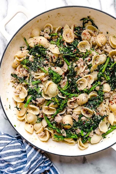 Orecchiette Pasta with Sausage and Broccoli Rabe uses chicken sausage in place of pork and a whole lot of garlic! This lightened up version will not disappoint!! Orecchiette With Sausage And Broccoli, Orecchiette With Sausage, Sausage And Broccoli Rabe, Broccoli Rabe And Sausage, Broccoli Rabe Recipe, Sausage And Broccoli, Pasta With Sausage, Italian Pasta Dishes, Broccoli Rabe