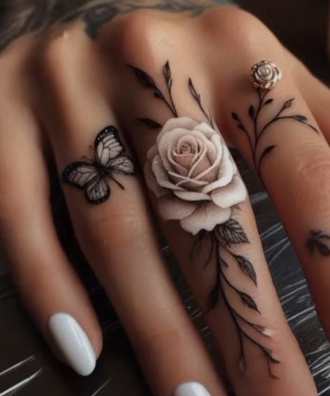 Cute Aesthetic Tattoos For Women, Rose Finger Tattoo For Women, Full Color Sleeve Tattoos Women, Womens Hand Tattoos Ideas, Feet Tattoos For Women Beautiful, White Floral Tattoo, Boujee Tattoos For Women, Pretty Skull Tattoos, Tattoo Designs With Meaning