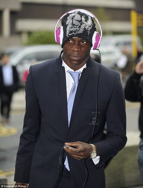 Mario Balotelli undoubtedly deserves the Skinnydipper of the Week title this week, pictured arriving at Manchester airport earlier in the week sporting a pair of hot pink headphones...    Mario, on his way to board a flight to Amsterdam, was also wearing a beanie hat, so his eye-catching headphones were placed over the top.     Mario - why not try our beanie hat headphones? They're more practical, stylish and not as attention-grabbing! Though perhaps the intention was to attract attention... Why Always Me, Mario Balotelli, Funny Home Decor, Conceptual Fashion, Football Fashion, Retro Aesthetic, Fitness Inspo, Style Icons, Boy Outfits