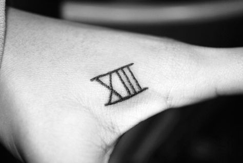 I don't like the placement but i do like the tattoo Roman Numeral 13 Tattoo, 13 Tattoo Meaning, Photographer Tattoo, Small Sister Tattoos, Tattoo Quotes For Men, 13 Tattoo, Camera Tattoos, 12 Tattoos, Roman Numeral Tattoos