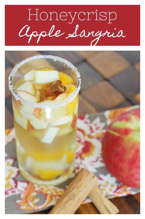 Honeycrisp Apple Sangria - the perfect fall drink! White wine sangria with honeycrisp apples, oranges, ginger, cinnamon, and cloves. Plus a cinnamon sugar rim! Orange Sangria, Apple Pie Cocktail, Cinnamon Sugar Rim, Honeycrisp Apple, Apple Sangria, White Wine Sangria, Holiday Snack, Wine Sangria, Fall Drink