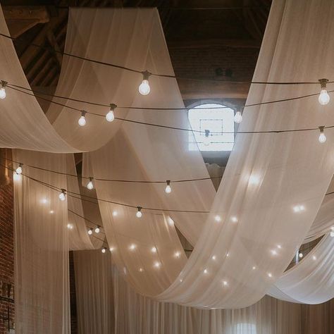 Aimee - WEDDING STYLING, COORDINATION & PROP HIRE on Instagram: "NO WORDS // because when images are as beautiful as this they’re sometimes not needed 🤍 Event Planning and Design // @wildeandvine Photography // @loveinbloom_weddings Venue // @godwickhall @godwickweddings Signage // @bewilderly Table Stationery // @rosewood_co Frames // @the.blissful.bride Textile Design + Fabric Installation // @miasylviaa & team @abbyspringham @allymfoster Floral Design // @wildeandvine Cake // @edge_by_imo Whimsical Ceiling Decor Wedding, Hanging Ceiling Decor Wedding, Wedding Decor Lights Indoor, Ceiling Decoration Wedding, Wedding Drapery Ideas Ceilings, Balloons At Wedding, Wedding Decor Ceiling, Tent Wedding Lighting, Event Lighting Ideas