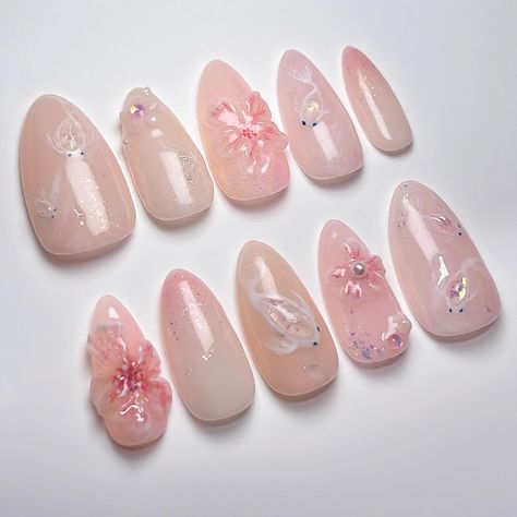 Sakura Koi Pond ❀*̥˚ ▫️ Custom Intricate Design tier on @apresnailofficial Medium Almond, client requested for a sakura floral and pink version of my Aurora Pond design for her graduation 💓 🧚🏻‍♂️ Shop press ons at janetsnails.com with code WELCOME10 to save on your first custom order 🌸 Free domestic shipping over $150CAD and Free International shipping over $250CAD ✨ Koi fish inspo: @faenails and @amys.clients #nailinspo #naildesign #pressonnails #3dnailart #vancouvernails #pressons #na... Koi Pond Nails, Soft Pink Nails Designs, Butterfly Nails Ideas, Koi Nails, Koi Fish Nails, Sakura Nails, Fish Nails, Soft Pink Nails, Shop Press