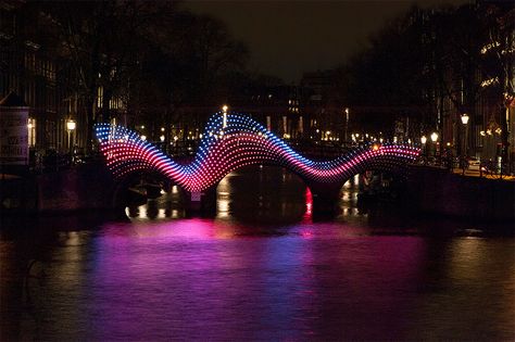 tjep. illuminates amsterdam's canals with undulating light bridge Bridge Lighting, Amsterdam Light Festival, Light Art Installation, The Shape Of Water, Light Festival, Amsterdam Canals, Facade Lighting, Urban Lighting, Urban Furniture