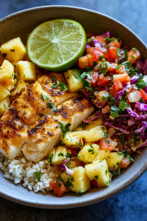 Indulge in this vibrant and healthy Low-Carb Fish Taco Bowl! Featuring flaky cod fillets, tangy Pineapple Lime Cauliflower Rice, and a crunchy Sweet and Spicy Coleslaw, this dish offers a delightful mix of flavors and textures. Perfect for a quick weeknight meal, this recipe is packed with nutritious ingredients and is sure to become a family favorite. Ready in under 30 minutes, it's an ideal choice for anyone looking to enjoy a delicious low-carb meal without sacrificing taste. Taco Fish Bowl, Fit Meals Recipes Clean Eating, Healthy Dinner With Fish, Healthy Thai Recipes Clean Eating, Rice Fish Bowl, Cod Taco Bowl, Cod Fish Bowls, Low Calorie Flavorful Recipes, Easy Meals Healthy Clean Eating