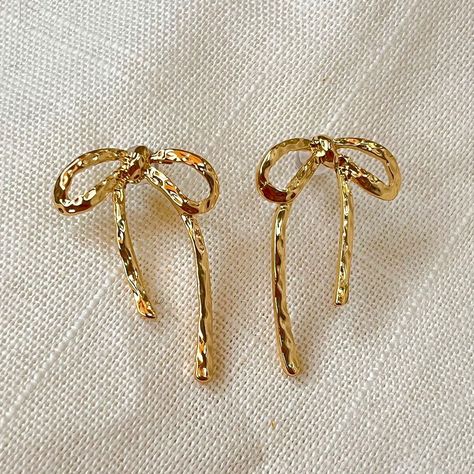 Molten bow earrings 🎀 #jewellerydesign #jewelleryshopping #antitarnishjewelry #18kgoldplated #bowearrings #jewellerylover Gold Party Earrings, Gold Bow Earrings, Dangly Gold Earrings, Elegant Gold Earrings, Bow Earring, Jewelry Gold Earrings, Earring Dangle, Tarnished Jewelry, Gold Dangle Earrings