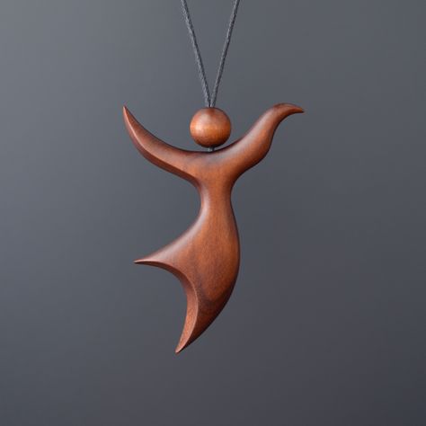 "Romantic pendant \"Dance of Wind\". This handmade wooden pendant is made of stained cherry wood. Pendant is perfectly polished and coated with natural protective varnish. Each jewelry is made by hand and therefore they are unique. Waxed cotton cord with sliding knots. Length adjustable from 16\" to 28\". Pendant is recommended not to wet in water. Please, write us if you have got any question. Materials: cherry wood. Size pendant:  height  2,4 inches (60mm)  width  1,8 inches (45mm)  depth  0,3 inches (8mm) Thank you for visiting our shop." Wooden Jewelry Handmade, Art Sculpture En Bois, Wood Necklace Pendant, Woodturning Art, Wood Jewelery, Wood Art Projects, Romantic Necklace, Necklace Wood, Diy Wooden Projects