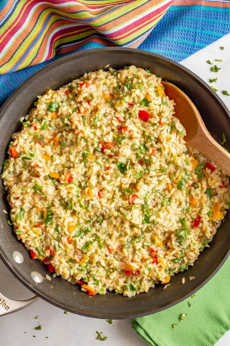 Confetti rice is a fun mix of fluffy brown rice and colorful bell peppers that’s great as a side dish or for tacos or grain bowls. Add your favorite toppings and enjoy! #rice #sidedish #easyrecipe #healthyrecipes Fluffy Brown Rice, Confetti Rice, Taco Side Dishes, Grain Bowls, Food On The Table, Rice Side, Brown Rice Recipes, Rice Side Dishes, Easy Rice Recipes