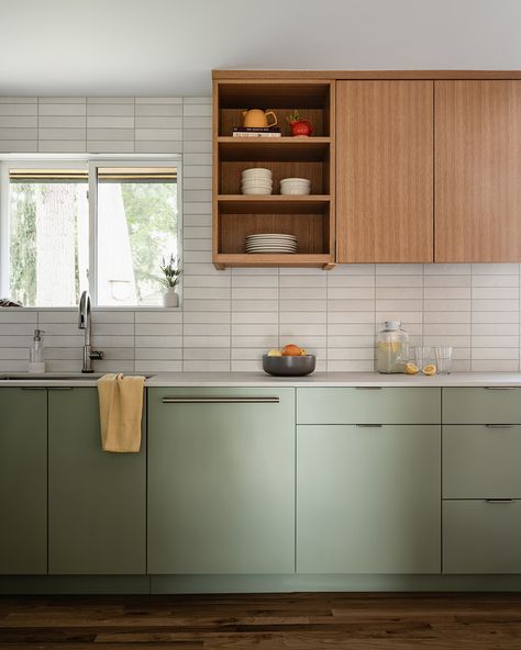 This kitchen features sleek, minimalistic cabinetry in a soft, pale green hue and a complimentary wood. The goal was to create a refreshing and contemporary ambiance while paying homage to the home's Mid-Century architecture. I think our talented team nailed it!⁠ 🙌🏻⁠
⁠
Check out The Home Code w/ Suzy Scott coming soon!⁠
⁠
#thehomecode #skinteriors #suzannekristineinteriors Pale Green And Wood Kitchen, Sage Green And Oak Kitchen, Green Oak Kitchen, Contemporary Green Kitchen, Sage Green And Wood Kitchen, Green And Wood Kitchen, Pale Green Kitchen, Laneway House, Mid Century Architecture