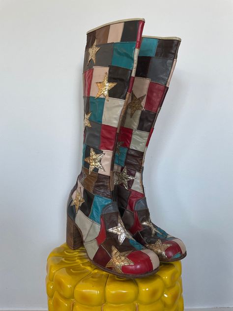 "ITEMS PURCHASED BETWEEN 11/20-1130 WILL SHIP 12/1  Andy from JJ Flash would fly to England and have these boots custom made.  As is, no returns. See full description and images. Iconic early 1970s glam rock boots. Patchwork outer with red, teal, plum, black, brown, and grey leather. Silver snakeskin stars appliqued on top. Lined in solid brown leather. Interior zipper and wooden stacked block heel. \"Made in England\" faintly stamped on the bottom. Damage notes: Wear consistent with age. Some s 1970s Glam Rock, 70s Rockstar, 1970s Glam, Thought Daughter, Dr Shoes, Shoe Wishlist, Funky Shoes, Leather Patchwork, Aesthetic Shoes