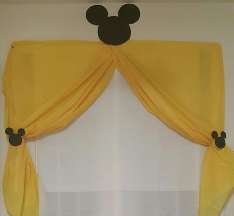 Backdrop for birthday table! (White and yellow tablecloths draped like curtains with Mickey silhouettes for accent.) Mickey Bedroom, Mickey Mouse Backdrop, Simple Backdrop, Twodles Birthday, Mickey Mouse Decorations, Mickey Mouse First Birthday, Backdrop For Birthday, Mickey Birthday Party, Mickey Silhouette