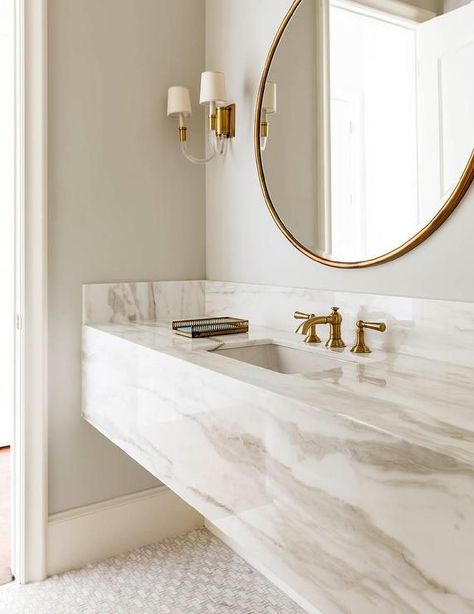 Chic bathroom boasts a grey and white marble floating vanity sink, suspended over a marble mosaic ... Drømme Bad, Bathroom Vanity Style, Modern Luxury Bathroom, Bilik Air, Interior Boho, Interior Design Minimalist, Gold Bathroom, Chic Bathrooms, Floating Vanity