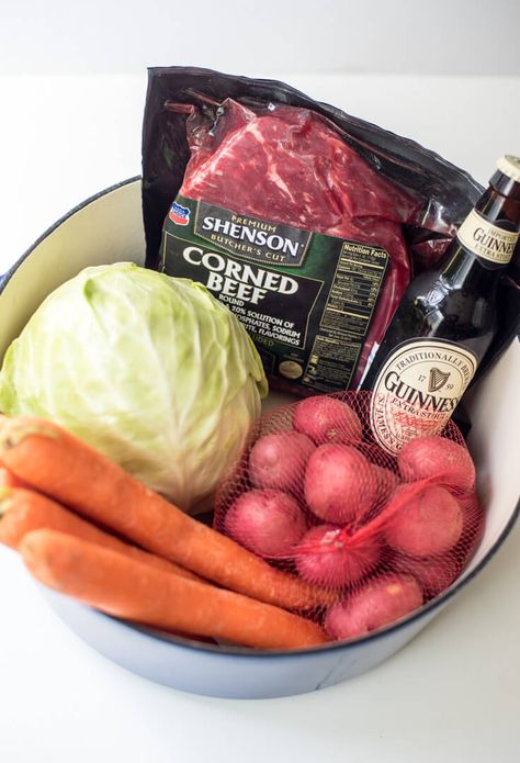 Guinness and beef broth cook down into a rich cooking liquid for corned beef, cabbage, carrots, and potatoes. Guinness Corned Beef is a one-pot wonder! Guinness Braised Corned Beef, Cabbage Carrots And Potatoes, Guinness Corned Beef And Cabbage Dutch Oven, Irish Corn Beef And Cabbage Recipe, Beef With Cabbage, Guinness Corned Beef, St Pattys Day Food Irish Recipes Corned Beef And Cabbage, Cabbage Potatoes, St Patricks Food