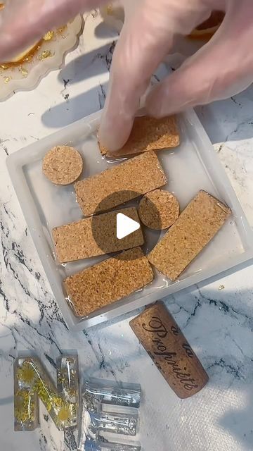 Resin About | Katherine Price on Instagram: "Well you guys enjoyed the last reel of this make so here’s a new one…this collection of handmade coasters featuring wine corks and mesmerizing gold leaf on sleek black shimmering resin - Finished piece shown at the end 🖤✨

These coasters are a beautiful fusion of classic and contemporary design. Each coaster is meticulously handcrafted, incorporating real wine corks that bring a touch of rustic charm. The wine corks are showcased within a striking black resin, adorned with luxurious gold leat accents, creating a stunning contrast that catches the eye.

Set the stage for your next wine tasting or gather around with friends for a refreshing cocktail - these coasters are the perfect conversation starter. 

🌟Elevate your sips in style with these w Wine Cork Coasters, Resin Art Canvas, Cork Art, Diy Resin Projects, Wine Cork Crafts, Summer Mantle Decor, Diy Epoxy, Epoxy Resin Crafts, Handmade Coasters