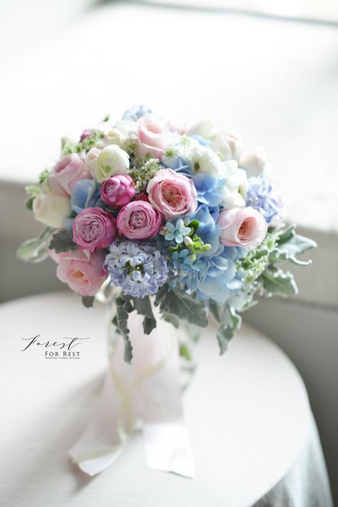 Blue hydrangea, garden rose and ranunculus bouquet  blue and pink bouquet  Facebook: Forest for Rest Ranunculus Hydrangea Bouquet, Blue Hydrangea Garden, Blue And Pink Bouquet, Blue Hydrangea Centerpieces, Blue Hydrangea Bouquet, Realistic Wedding, Ranunculus Bouquet, Hydrangea Centerpiece, Hydrangea Bouquet