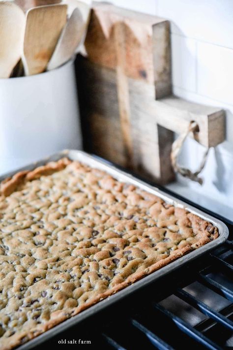 Rich and chewy sheet pan chocolate chip cookie bars have thick, crusty edges and a soft, chocolatey center. Easy to make and faster than traditional cookies! Chocolate Chip Pan Chewy, Chocolate Chip Cookie Bars 10x15, Choco Chip Cookie Bars, Cookie Sheet Recipes, Sheet Cookie Bars, Easy Jelly Roll Pan Bars, Chocolate Chip Cookies Bars 9x13, Cookie Sheet Cookies, Chocolate Chip Cookie Sheet Pan