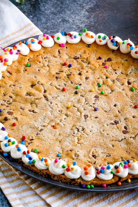 An easy and delicious recipe for Giant M&M Cookie Cake is best served warm with a scoop of ice cream.  Crisp edges and a chewy, gooey center are what make this extra-large cookie recipe the best! It's perfect to share with friends and family on any occasion. M&m Cookie Cake Recipe, Giant Cookie Recipe, Ultimate Chocolate Chip Cookie, Scoop Of Ice Cream, Pan Cookies, M M Cookies, Cookie Pizza, Giant Cookie, Milk Chocolate Candy