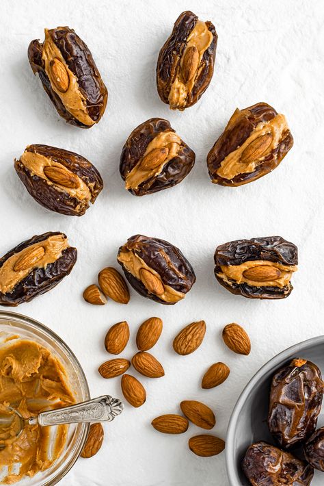 Take a moment, grab a date, some peanut butter 🥜, an almond, close your eyes and savour the sticky, caramely, peanut buttery wonderfulness 🥰 It's our Favourite Fastest Snack In The World! There's not much of a recipe... but we wrote it up anyway. Read about our love of dates here ⤵️ https://tastythriftytimely.com/peanut-butter-filled-dates/ *Approximate cost: 🇨🇦$0.35/each #tastythriftytimely #veganfood #plantbasedfood #vegansnacks #peanutbutterdates #glutenfreesnacks Peanut Butter Filled Dates, Dates And Almond Butter, Filled Dates Recipes, Dates Snacks, Dates And Peanut Butter, Peanut Butter Dates, Filled Dates, Date Snacks, Dates Recipes