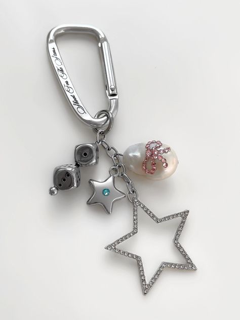 Encompassing all things Five Fourty Nine. From the dreamiest hues of baby pink and blue to one-of-a-kind pendants, the 'SHOOT FOR THE STARS' keychain will easily become your new favorite accessory. This is an exclusive 549 piece with very limited quantities. ☆ Made with stainless steel carabiner and pendants, AAA-grade crystals, and genuine freshwater baroque pearl ☆ 'Shoot For The Stars' engraving on front ☆ 'Five Fourty Nine' engraving on back ☆ Handmade with love in Los Angeles Charm Keychain Ideas, Pink Keychain Bag Charm For Personal Use, Pink Bag Charm Keychain For Personal Use, Pink Keychain Bag Charm For Gift, Pink Keychain Bag Charm As Gift, Cute Carabiner, Carabiner Keychain Aesthetic, Pearl Shoot, Car Keychain Aesthetic