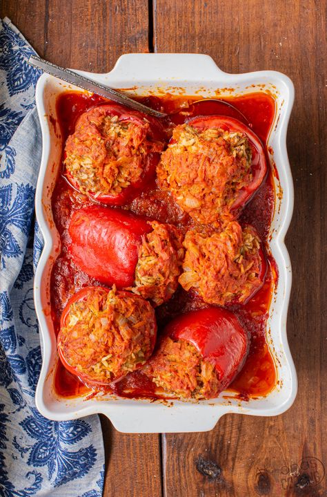 This Stuffed Peppers Recipe is a classic on our dinner table! Sweet bell peppers are stuffed with, ground beef, rice, and tomato sauce! Easy stuffed peppers couldn't be simpler! Sauce For Stuffed Peppers, Recipe With Tomato Soup, Rice And Tomato Sauce, Stuffed Bell Peppers Ground Beef, Best Stuffed Pepper Recipe, Sweet Pepper Recipes, Stuffed Peppers Beef, Stuffed Peppers With Rice, Ground Beef Rice