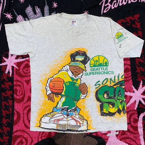 Vintage VINTAGE 90S SEATTLE SUPERSONICS T-SHIRT | Grailed Vintage 90s Tshirt Design, 90s Graphic Tees Vintage, Unfinished Legacy, 90s Graphic Tees, 90s Shirts Graphic Tees, Graphic Tees Vintage Outfit, Sports Merch, Vintage Graduation, Motor Cross