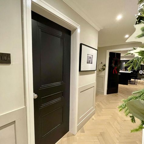 Black panelled internal door Black Wood Work Hallway, Black Doors And Skirting Boards, Internal Black Doors, White Hallway Black Doors, Black Doors Hallway, Black Door Hallway, Hallway Black Doors, Hallway With Black Doors, Black Hallway Doors