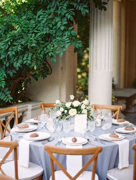 Slate Blue Linen Tablescape  Table setting, wedding tablescape, wedding table decorations, wedding place setting Mediterranean Tablescape, Wedding Table Settings Blue, Tablescape Photography, Dusty Wedding, Tasteful Wedding, Tablecloths Wedding, Round Table Settings, Wedding Reception Tablescapes, Round Wedding Tables