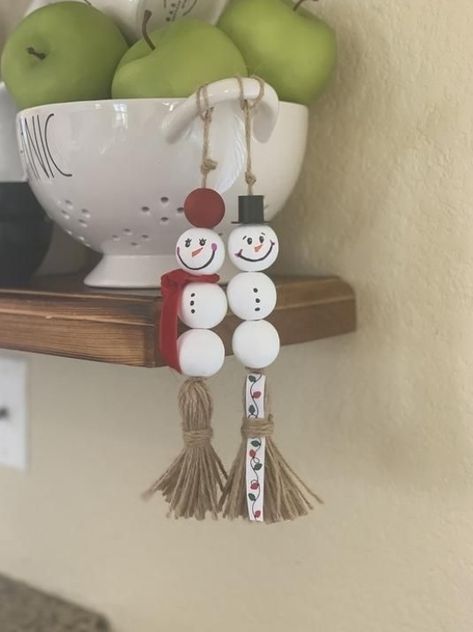 THIS LISTING IS FOR:-SET OF TWO: Natural Wood Bead Garland with twine tassel -8" each overall-25 and 30 mm beads-Snowman design - hand drawn! • • • • • • • • • • • • • • • • • • • • • • • • • • • • • • • • • Check out my awesome reviews from my amazing customers!• • • • • • • • • • • • • • • • • • • • • • • • • • • • • • • • • Introducing our Farmhouse Snowman Garland! What a beauty for your Christmas decor! This garland is a beautiful farmhouse rustic addition to your home! So cute! The will lo Snowman Garland, Farmhouse Snowman, Rustic Baby Shower Decorations, Wood Garland, Xmas Bells, Burlap Mason Jars, Wood Beads Diy, Diy Christmas Ornaments Easy, Wooden Bead Garland