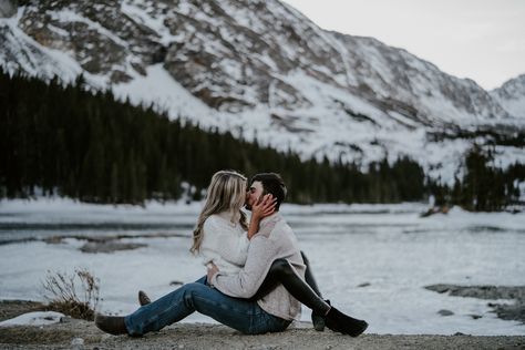 Woman sitting on her fiancé’s lap facing him kissing Sitting On Lap Facing Each Other, Hug In Bed, Frozen Waterfall, Snow Covered Mountains, Dog Snow, Fluffy Dog, Couple Stuff, Man Photography, Photography Company