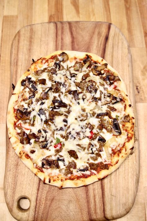 Grilled Sausage Mushroom Pizza is a super easy weeknight dinner that will rival your favorite take-out pizza restaurant. Homemade dough topped with Italian sausage, sautéed mushrooms, peppers, onions and plenty of cheese. Sausage And Mushroom Pizza, Sausage Pizza Recipe, Italian Sausage Pizza, Dinner For Family, Mushroom Pizza Recipes, Sausage Mushroom, Delicious Pizza Recipes, Fennel Sausage, Sausage Pizza