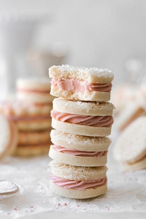 Buttery, soft-baked vanilla bean sugar cookies, filled with fluffy raspberry buttercream. Christmas Sandwich Cookies, Pink Cookies Recipe, Sandwich Cookies Recipes, Raspberry Sandwich Cookies, Sandwich Cookie Recipes, Sandwich Cookies Christmas, Raspberry Sandwich, Valentines Sugar Cookies, Fluffy Cookies