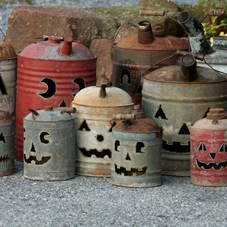 Vintage antique gas cans with jack-o-lantern faces cut into each by Tish, Mike and Ian Bachleda. Selection varies. Gas Can Jack O Lantern Diy, Oil Can Jack O Lantern, Metal Gas Can Ideas, Pumpkin Gas Cans, Antique Halloween Art, Pumpkins Made From Tin Cans, Gas Can Pumpkins Diy, Oil Can Pumpkins, Old Metal Gas Can Ideas