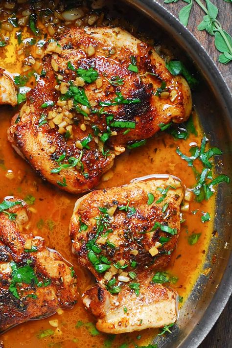 cajun chicken with garlic lemon butter sauce in a stainless steel pan. Cajun Chicken With Rice, Cajun Chicken Legs Recipes, Cajun Marinated Chicken, Cajun Chicken Thigh Recipes, Cajun Butter Chicken Thighs, Cajun Chicken Marinade, Cajun Honey Chicken, Cajun Chicken Thighs, Lemon Garlic Butter Chicken Thighs