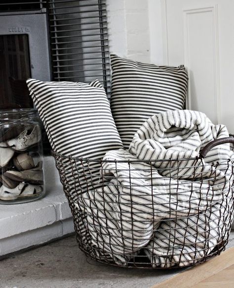 23 Pretty Ways to Use Baskets As Extra Storage in Small Spaces | Brit + Co Smart Tiles, Wire Basket, Blanket Storage, My New Room, Living Room Inspiration, Apartment Living, Cozy House, Home Living Room, Home Deco